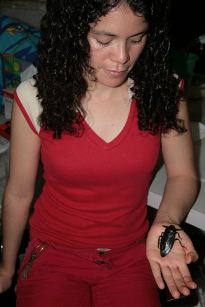 Elisa Cabrera-Guzmán with a giant waterbug.